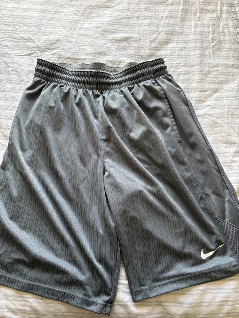 Nike mens Gray Athletic Shorts with White Swoosh in great condition